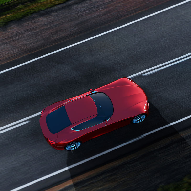 Aerial Shot of Red Car on Road